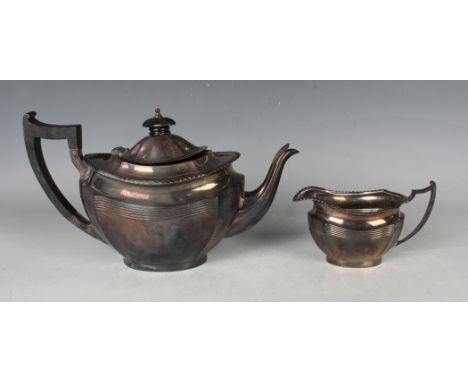 An Edwardian silver teapot and milk jug, each of lobed oval form with gadrooned rims, Chester 1909 by Barker Brothers, weight