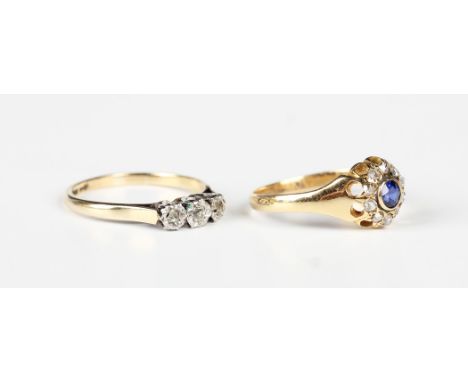 A gold, sapphire and diamond cluster ring, first quarter of the 20th century, collet set with the cushion cut sapphire within