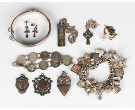 A group of mostly silver jewellery, including a curblink charm bracelet, fitted with a variety of charms, a bracelet made fro