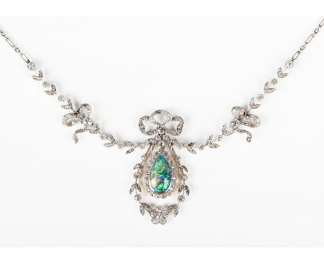 An opal and diamond necklace, circa 1920, the front of floral and foliate wreath form with a tied bow surmount, the sides wit