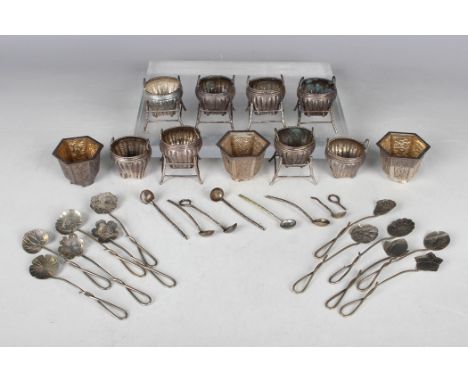 A set of eight late 19th/early 20th century Chinese silver salts, each in the form of a two-handled basket, height 3.5cm, wit