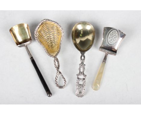 An early Victorian silver caddy spoon of basketweave form with gilt bowl and cast entwined ropetwist handle, London 1859 by C