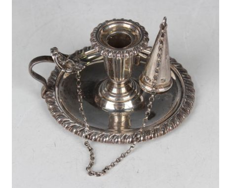 An early Victorian silver chamberstick, the tapering lobed urn shaped sconce with detachable conical snuffer and detachable g