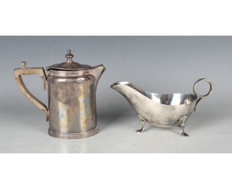 A Victorian silver hot water jug of oval form with reeded rims, London 1891 by Mappin &amp; Webb, height 13cm, and a silver s