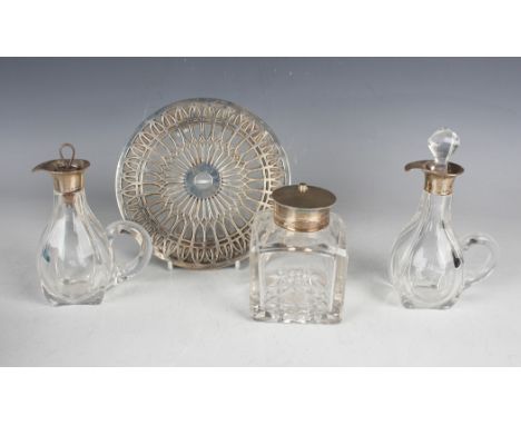 A late Victorian silver mounted cut glass square inkwell, the hinged lid with rotating top revealing an aperture, London 1895