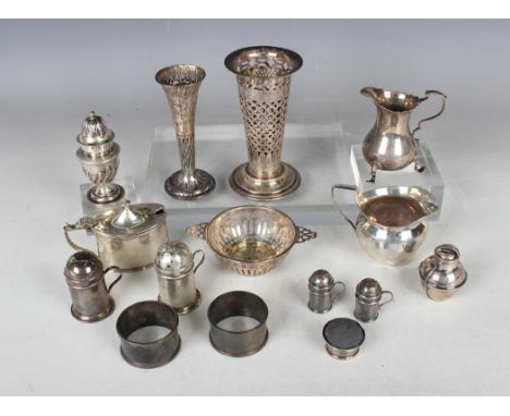 A George V silver oval mustard, Birmingham 1928, and a small group of other silver items, including pepper casters, two spill