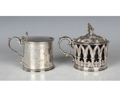 An early Victorian silver cylindrical mustard, the hinged lid embossed with gothic arches above similarly decorated pierced s