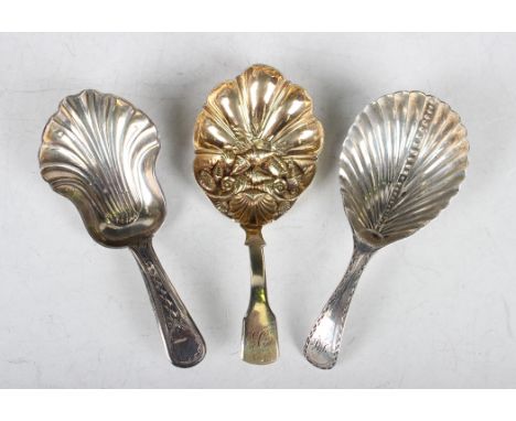 A George III silver gilt Fiddle pattern caddy spoon, the stylized scallop shell bowl embossed with a group of seashells, Birm