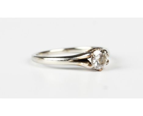 A diamond single stone ring, claw set with the circular cut diamond between split shoulders, indistinct mark, ring size appro