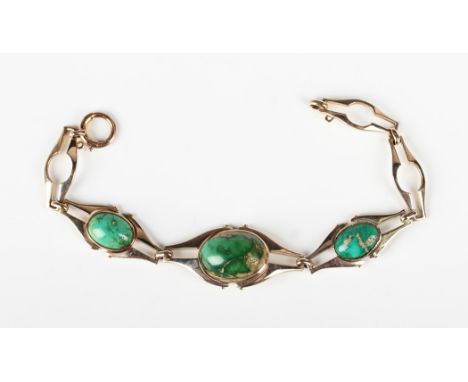 An Art Nouveau Murrle Bennett &amp; Co gold and turquoise matrix bracelet, the front mounted with three graduated oval turquo
