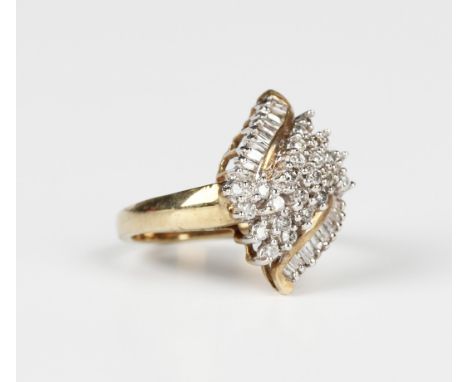 A 9ct gold and diamond ring in a spiral lozenge shaped cluster design, mounted with circular cut and baguette diamonds, Birmi