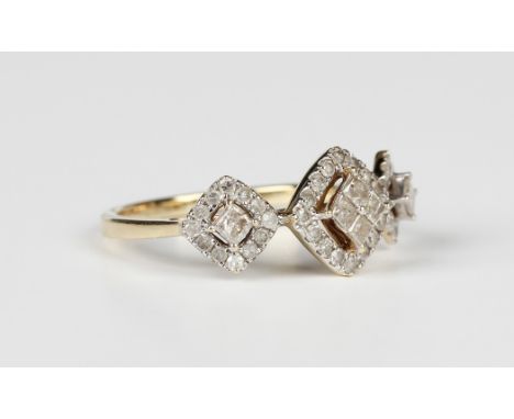 A 9ct gold and diamond ring, in a triple cluster design, mounted with princess cut diamonds within openwork surrounds, set wi