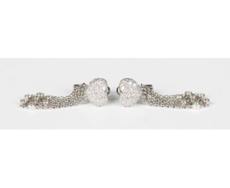 A pair of white gold and diamond pendant earrings, each with a heart shaped surmount, pavé set with circular cut diamonds, wi