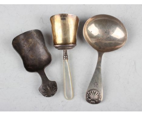 A Victorian silver and mother-of-pearl handled caddy shovel, Birmingham 1887 by Hilliard &amp; Thomason, length 8.5cm, anothe
