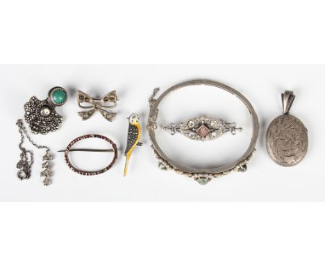 An Austrian silver quartz cat's eye and seed pearl oval hinged bangle, circa 1920, weight 16.4g, inside width 5.8cm, a silver