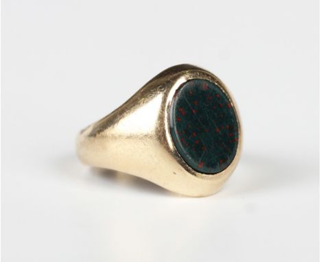 A 9ct gold and oval bloodstone signet ring, Birmingham 1973, weight 4.6g, ring size approx I.Buyer’s Premium 29.4% (including