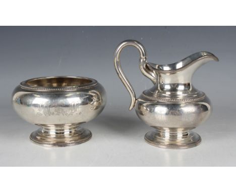 A mid-19th century American silver milk jug and matching sugar bowl, each of squat baluster form with beaded rims, maker's ma