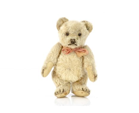 A rare Steiff small sized Jackie teddy bear 1953,  with pale golden mohair, clear and black glass eyes with brown painted bac