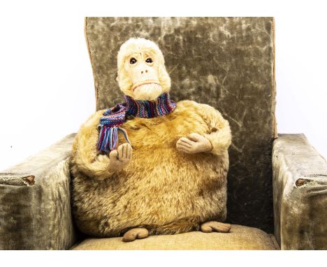An Omega (British United Toy Manufacturing Co Ltd) monkey tea cosy 1930s,  with light brown mohair, orange and black glass ey