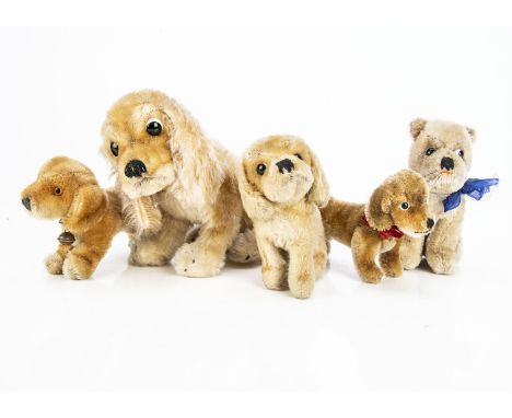 Four Steiff post-war dogs,  comprising a seated Mopsy, two Bazi and two Revue Susi, one with script button —6in. (15cm.) heig