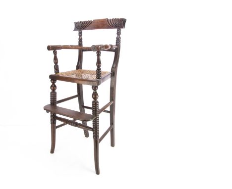 An early 19th century faux rosewood child's highchair,  with fluted carved back rest, bobbin turned curved back support and f