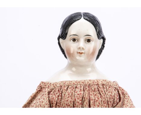 A small Kloster Veilsdorf china shoulder-head Grenier-type child doll,  with brown painted eyes, lower eye lashes, red eyelid