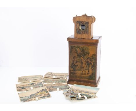 A mid 19th century peep show box, the paper-covered wooden rectangular box with separate periscopic viewer inserted on top, a