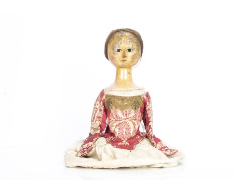 A rare large late 18th century English carved and painted wooden doll's head and torso, with inset dark enamel eyes, single d