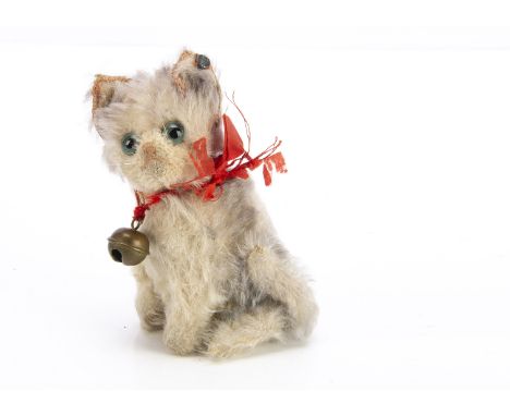 A small Steiff seated Fluffy cat 1920s,  with grey tipped and white mohair, greenish/blue and black glass eyes, pink stitched