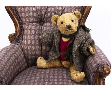 A 1930s Chiltern-type pink artificial silk plush teddy bear,  with orange and black glass eyes, pronounced muzzle, black stit