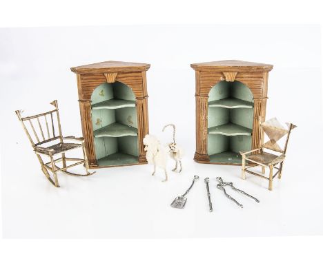 Two dolls’ house feather chairs,  one a rocker —3½in. (9cm.) high; a pair of pine corner shelves with green painted interior;