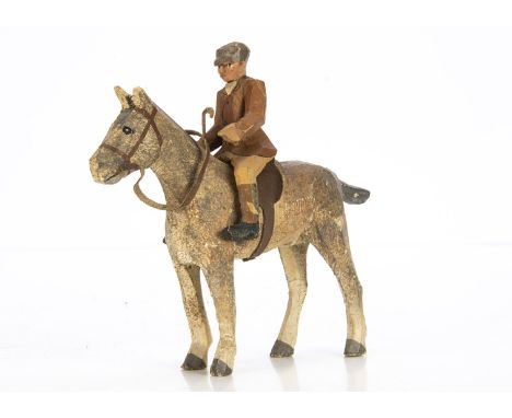 A Forest Toy small scale man on grey horse, hand painted carved wood, in grey peak cap, brown jacket, on grey horse --4½in. (