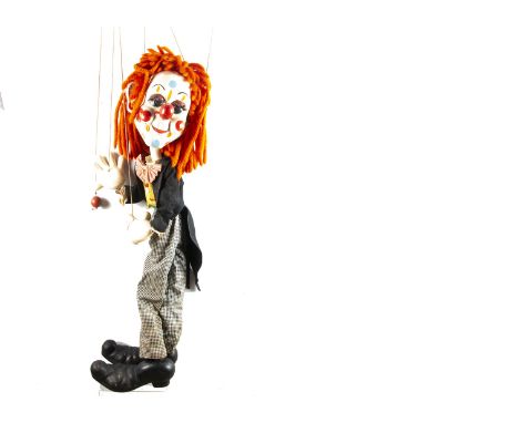 A large Pelham Puppet Bimbo the Clown display puppet,  with orange wool hair, wooden labelled control --58in. (147cm.) high (