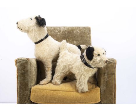 Two 1920s British mohair terriers, the larger standing with clear and black glass eyes, black stitched nose and mouth, black 