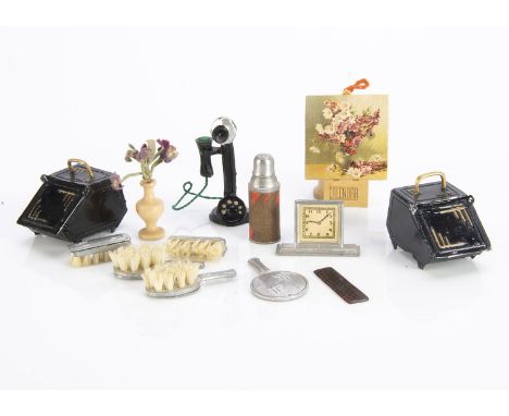 1930s German metal dolls’ house chattels, Including a thermos flask —1½in. (4cm.) high; a dressing table brush and mirror set