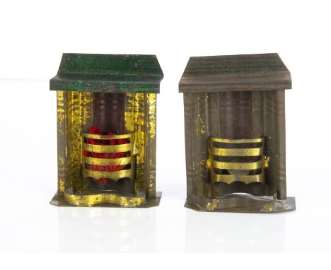 Two spirit painted tinplate dolls’ house fireplaces, gold surround and green mantel shelf with wool flames —3½in. (9cm.) high