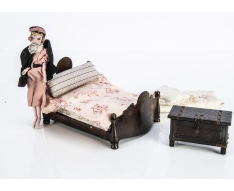A Tri-ang Period Furniture Queen Anne dolls’ house bed, with mattress and bedding (slight paint flaking); an oak blanket ches