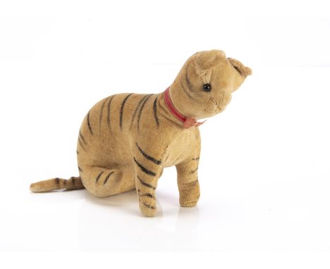 An early German velvet seated kitten circa 1905,  of white velvet with painted black stripes, black boot button eyes, pin sti