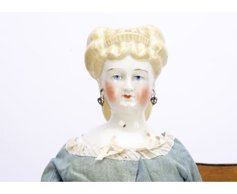 A German china shoulder-head lady doll with elaborate hairstyle,  probably by Conta &amp; Boehme with blue painted upward gla