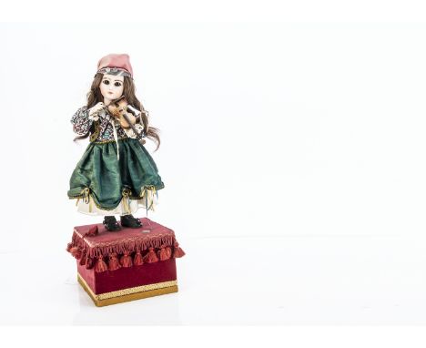 A recent automaton girl violinist,  with bisque Jumeau style head signed CAS 91, hair wig, gypsy style costume, standing on r