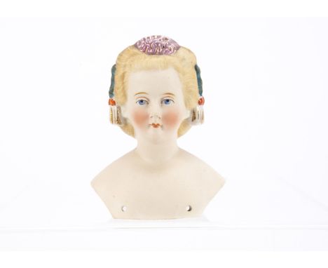 A German bisque shoulder-head doll with hair ornaments, probably Conta &amp; Boehme or Eberlein with blue painted upwards gla