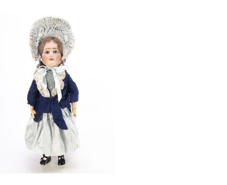 A Limoges child doll,  with blue sleeping eyes, light brown mohair, pierced ears, jointed composition, recent light blue and 