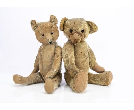 Two worn pre-war teddy bears, a 1920s  English bear with light golden mohair, orange and black glass eyes, swivel head and jo