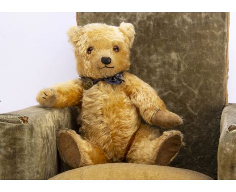 A 1930s Chiltern Hugmee teddy bear,  with golden mohair, orange and black glass eyes, pronounced clipped muzzle, black stitch