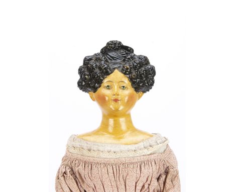 A rare German pâpier-maché shoulder-head doll with moulded elaborate hair 1830s, with blue painted eyes, black painted and mo