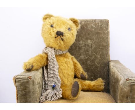 A 1940s British teddy bears,  with golden mohair, clear and black glass eyes with remains of light brown painted backs, sligh