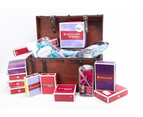 A selection of Pleasant Company  American Girl clothes and accessories, including Julie's peasant top outfit, and tunic outfi