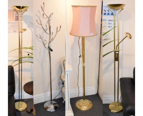 Two brass uplighters, a silvered uplighter and a naturalistic standard lamp, together with a gilt metal reeded standard lamp 