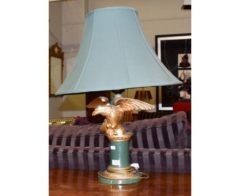 A Regency style eagle form gilt and green painted table lamp with green shade, 74cm including shade