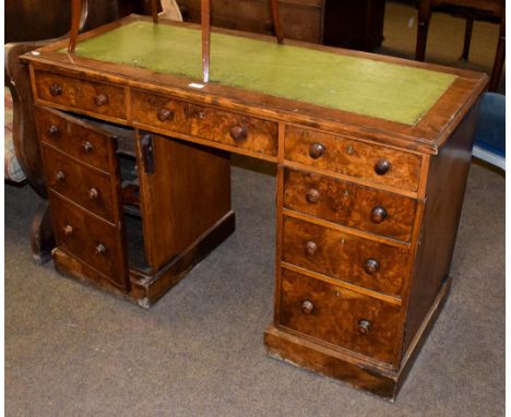 A late Victorian walnut veneered twin pedestal writing desk, 122cm by 53cm by 77cm
